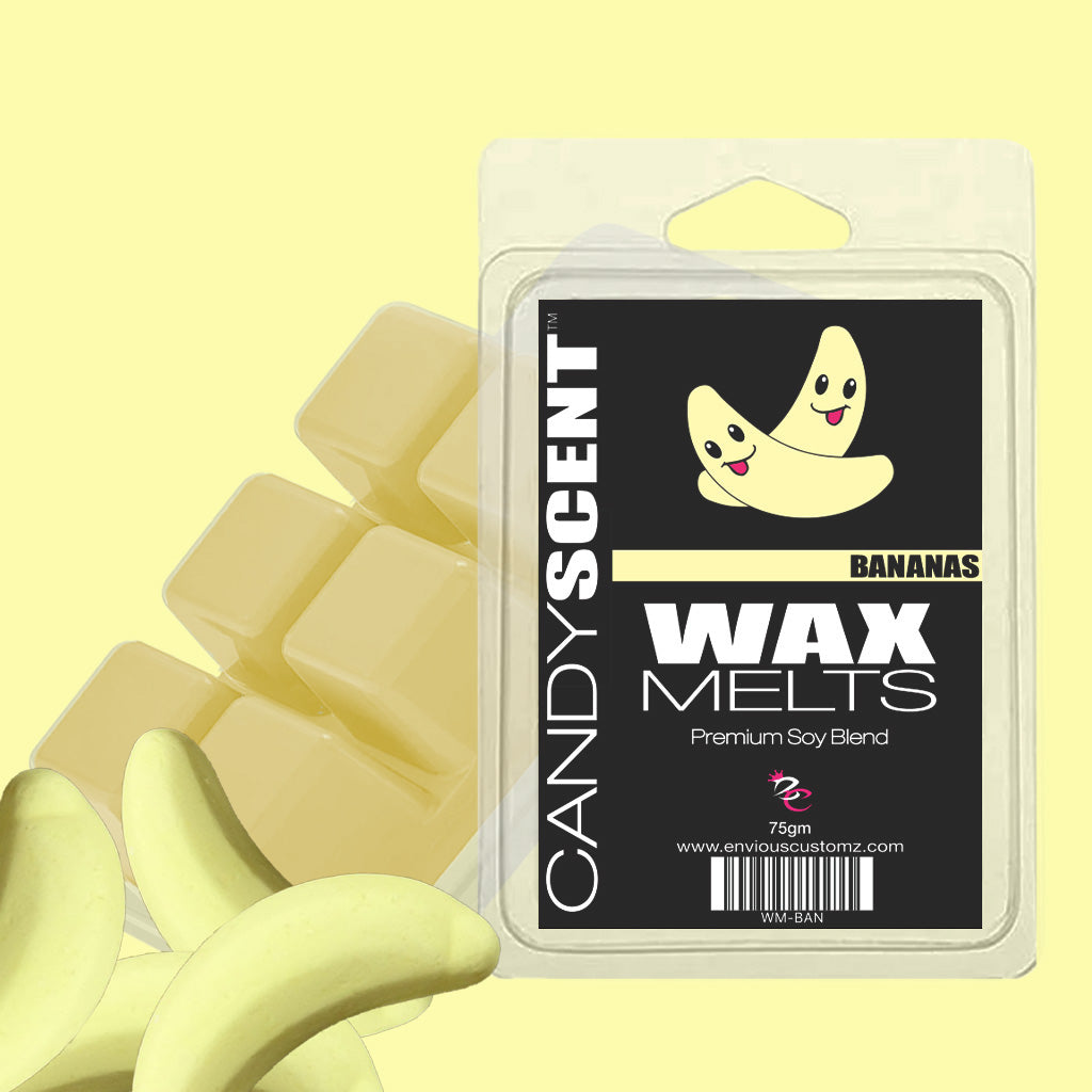 The image showcases a package of CANDYSCENT™ Wax Melts in a delightful banana scent. The packaging is adorned with cheerful banana characters and contains several highly scented wax cubes. Made from a premium soy blend, these melts transport you to a fragrant paradise and weigh 75 grams.