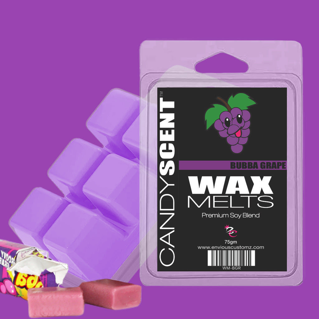 Visual of a package of CANDYSCENT™ Wax Melts in Bubba Grape flavor. The purple packaging showcases an illustration of a grape cluster. Next to the package are pink and purple wax melt cubes and a partially unwrapped grape-flavored candy bar, creating a fragrant paradise with these highly scented wax melts.