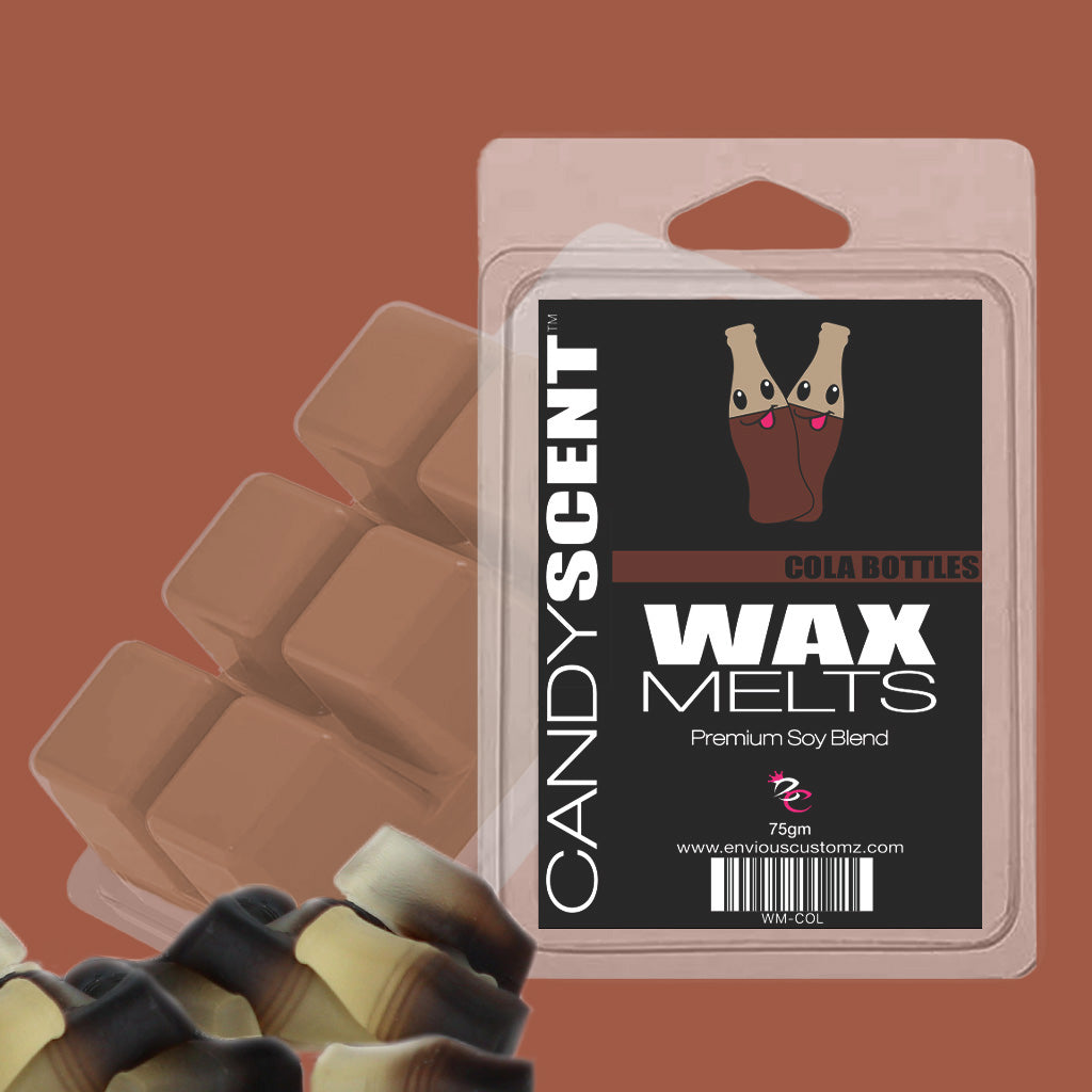 Image of a package labeled "Wax Melts - Cola Bottles." The packaging includes an illustration of cola bottle candies. Additional CANDYSCENT™ Wax Melts cubes can be seen in the background, offering a fragrant paradise with their blend of brown and cream colors.
