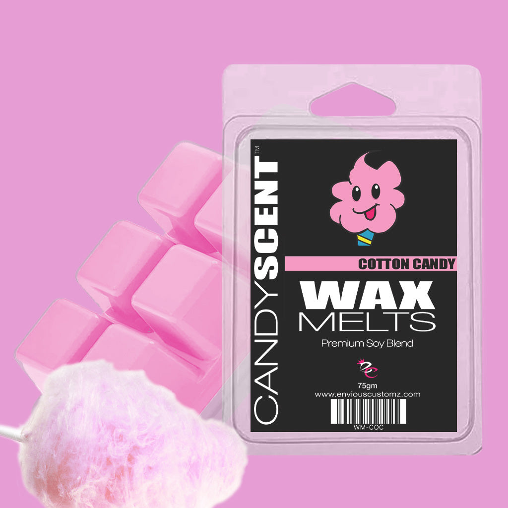 A package of CANDYSCENT™ Wax Melts is showcased against a pink backdrop, presenting a fragrant paradise with the delightful scent of cotton candy. The packaging highlights an adorable cotton candy character, accompanied by pink wax blocks and a cotton candy cone on the side.
