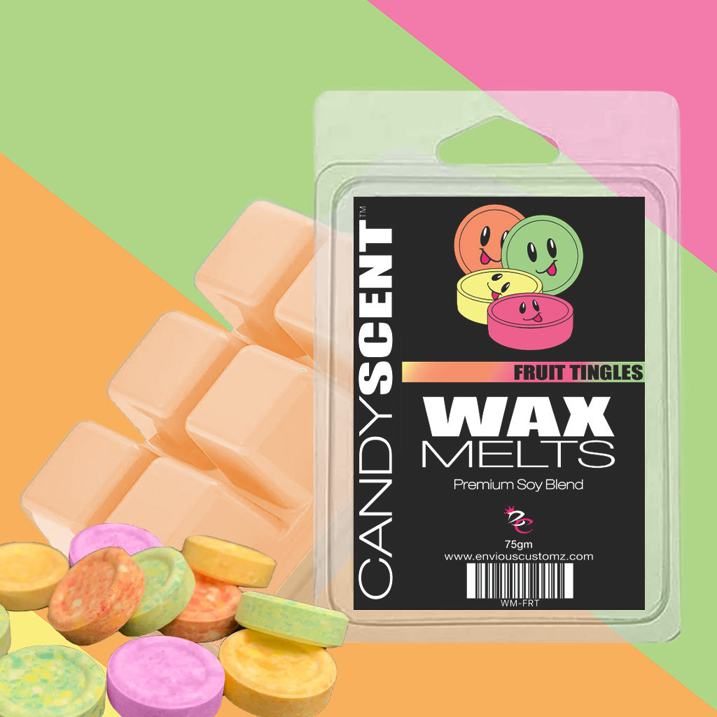The image displays a package labeled "CANDYSCENT™ Wax Melts" featuring the enticing "Fruit Tingles" scent. The packaging, decorated with cartoon faces on round candies, is surrounded by colorful candy discs and wax cubes, forming a fragrant paradise against a vibrant backdrop.