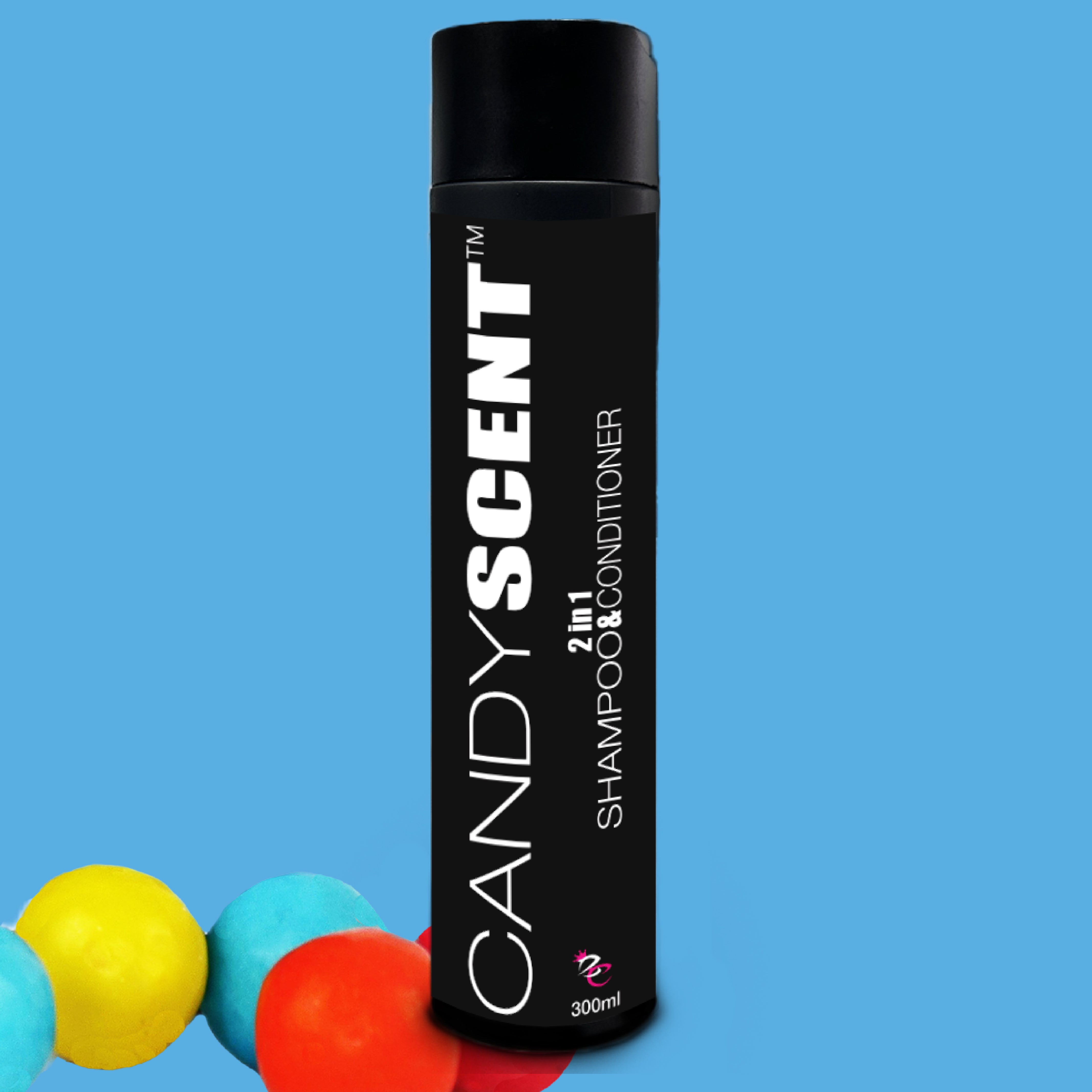 A black bottle of CANDYSCENT™ 2 in 1 Shampoo & Conditioner stands against a blue background. Featuring white text, it holds 300 ml and promises a silky finish. Three colorful balls (blue, yellow, and red) are placed at the bottom left corner of the image.