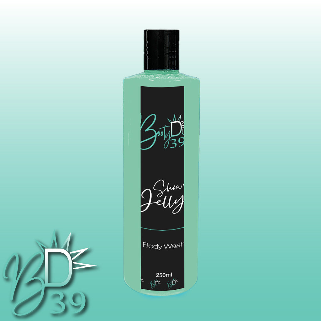 Image of a green bottle labeled "BOOTY DUPE" containing 250ml of Shower Jelly Body Wash. The bottle features a black label with white cursive text that says "Shower Jelly". The background is a gradient from light green to white, and the BOOTY DUPE logo is prominently displayed in the lower left corner.