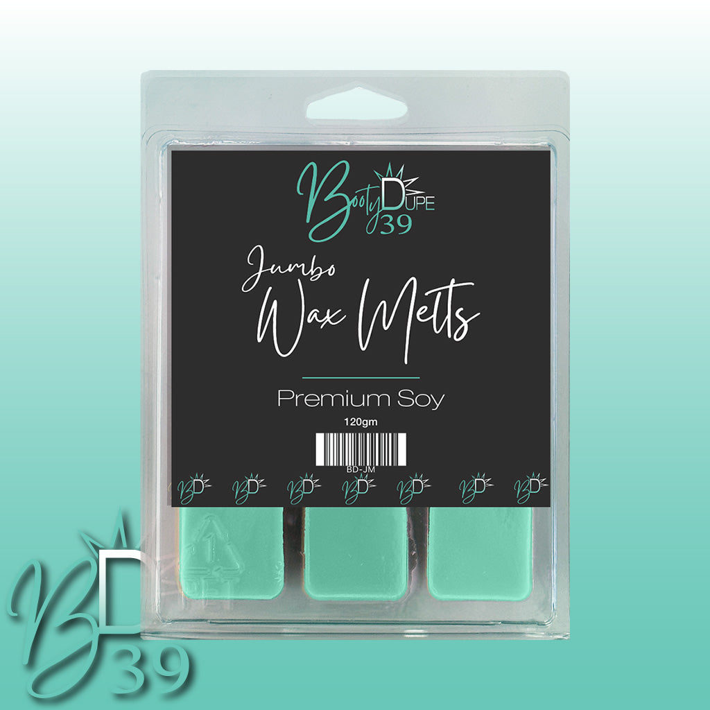 A package of Soy Wax Melts from BOOTY DUPE is displayed, labeled as "Premium Soy" with promises of highly scented melts in captivating fragrances. The packaging is predominantly green and black, featuring a barcode and decorative text.