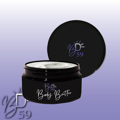 A black jar of BOOTY DUPE Body Butter sits against a gradient background, its slightly open lid revealing a smooth, creamy texture that promises deep nourishment and hydration. The BOOTY DUPE logo is prominently displayed on the jar and in the bottom left corner.