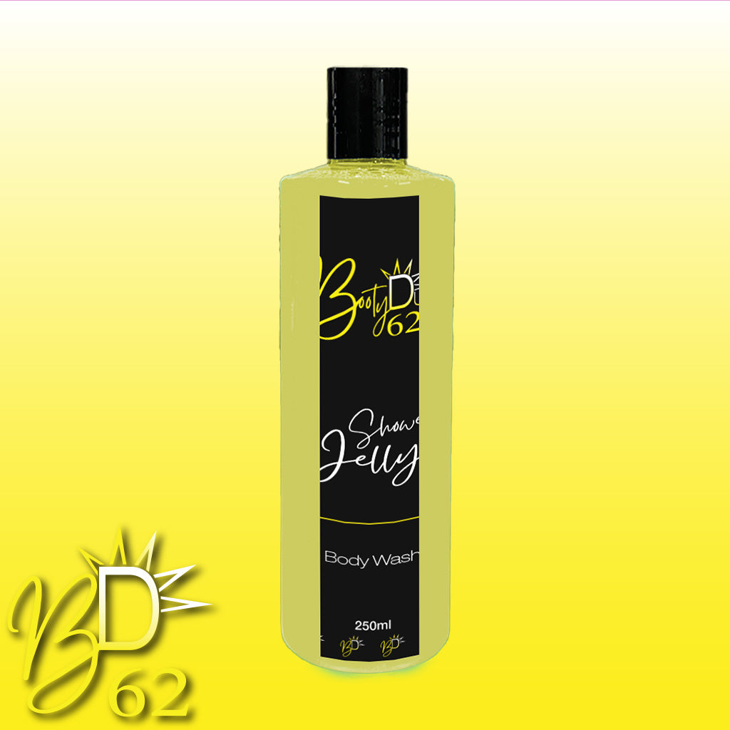 A bottle of BOOTY DUPE Shower Jelly Body Wash in yellow and black, containing 250 ml of this nourishing body cleanser, is displayed against a gradient yellow background. The BOOTY DUPE logo, featuring a stylized sun and the number 62, is prominently shown in the bottom left corner of the image.