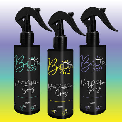 Three bottles of BOOTY DUPE "Heat Protection Spray" with black packaging promise salon-quality results, each featuring numbers 39, 62, and 65 on their vibrant labels set against a gradient backdrop. These 200ml bottles come with a trigger spray nozzle for an effective and convenient hair strengthening routine.