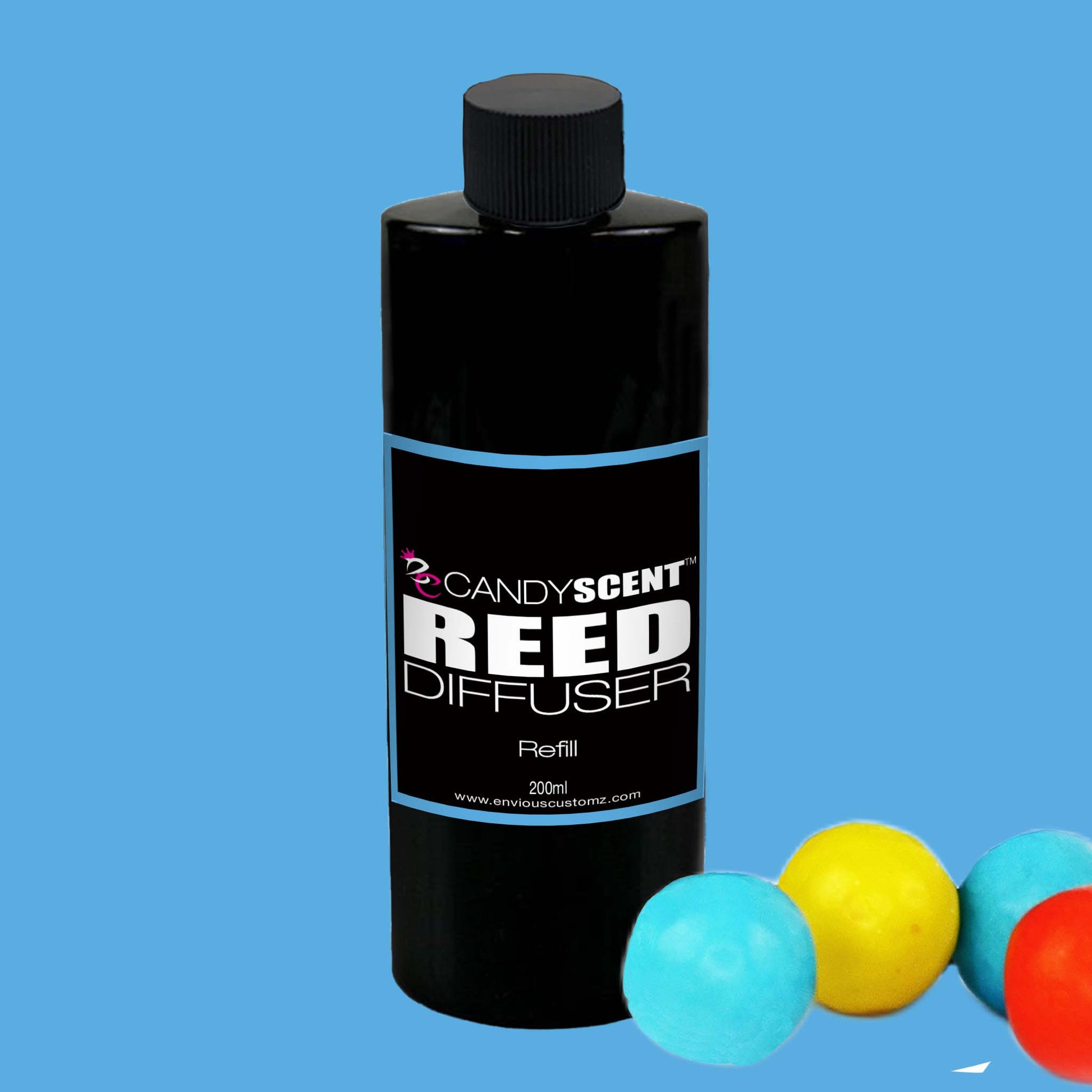 A black bottle labeled "CANDYSCENT™ Reed Diffuser Refill," boasting a capacity of 200ml, is centered against a blue background. Highlighting its Australian-made quality and long-lasting fragrance, three colored balls—blue, yellow, and red—are partially visible in the bottom right corner.