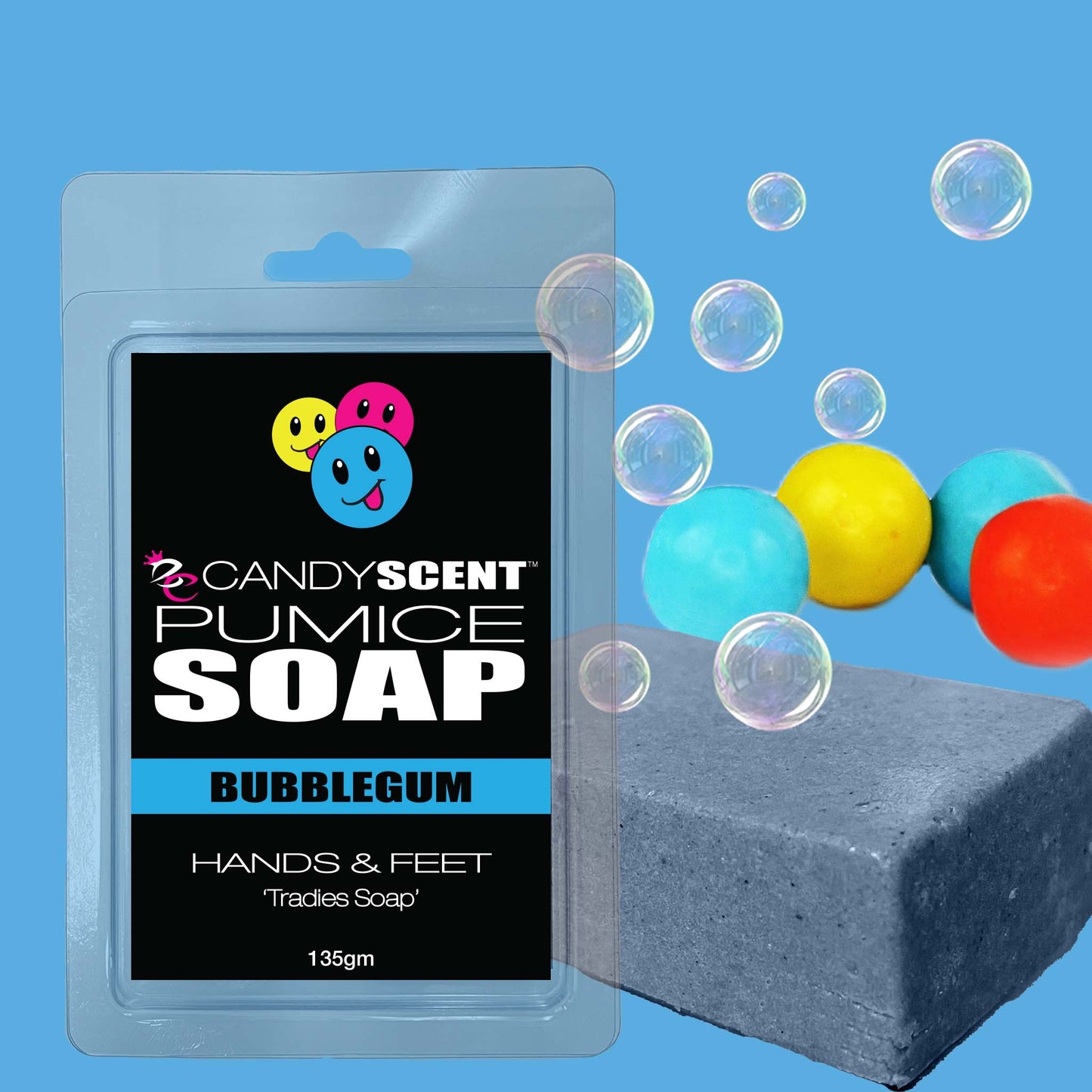 The image shows a packaged bar of CANDYSCENT™ Pumice Soap in bubblegum scent. The package is blue with colorful smiley face icons. There are several colorful balls and bubbles around the exfoliating soap. The label indicates it's for hands and feet, and weighs 135g—perfect for tradies needing a good scrub.