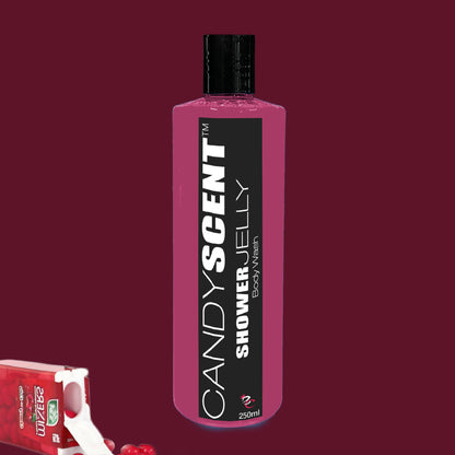 A bottle of CANDYSCENT™ Shower Jelly Body Wash stands upright against a solid burgundy background. The vibrant pink bottle, adorned with a sleek black label and cap, promises a luxurious shower experience. To the lower left, an open pack of chewing gum with scattered pieces and a few cherries are visible.