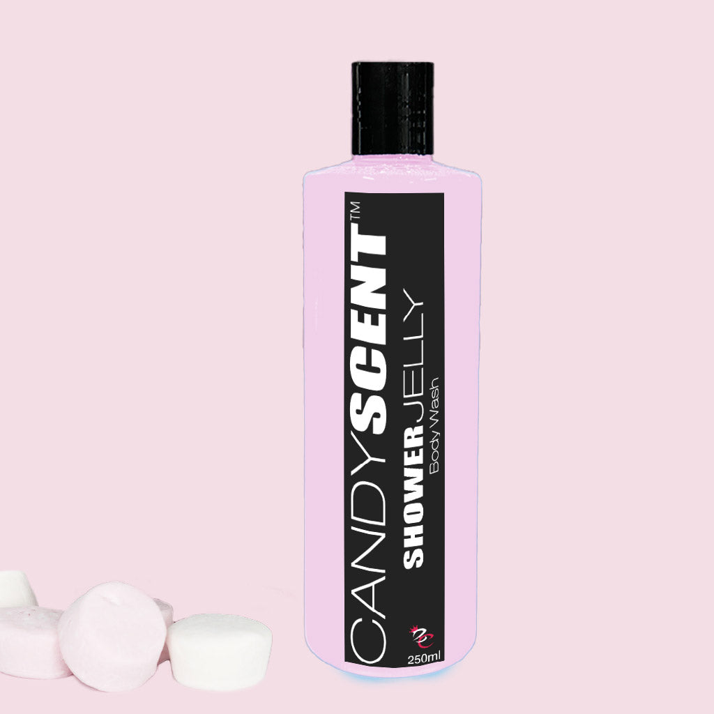 A pink bottle labeled "Shower Jelly Body Wash" from CANDYSCENT™, featuring a sleek black and white design, stands upright against a pink background. The bottle, promising a luxurious shower experience, is topped with a black cap. Small white and pink marshmallow-like objects are scattered in the bottom left corner.