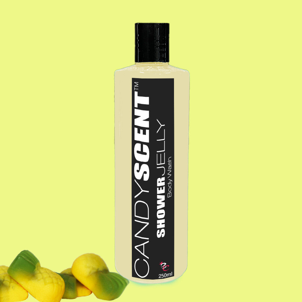 A 250ml bottle of CANDYSCENT™ Shower Jelly Body Wash is showcased against a light yellow backdrop. The bottle, adorned with a black label, promises a luxurious shower experience and is accompanied by three soap bars shaped like lemons positioned on the bottom left.