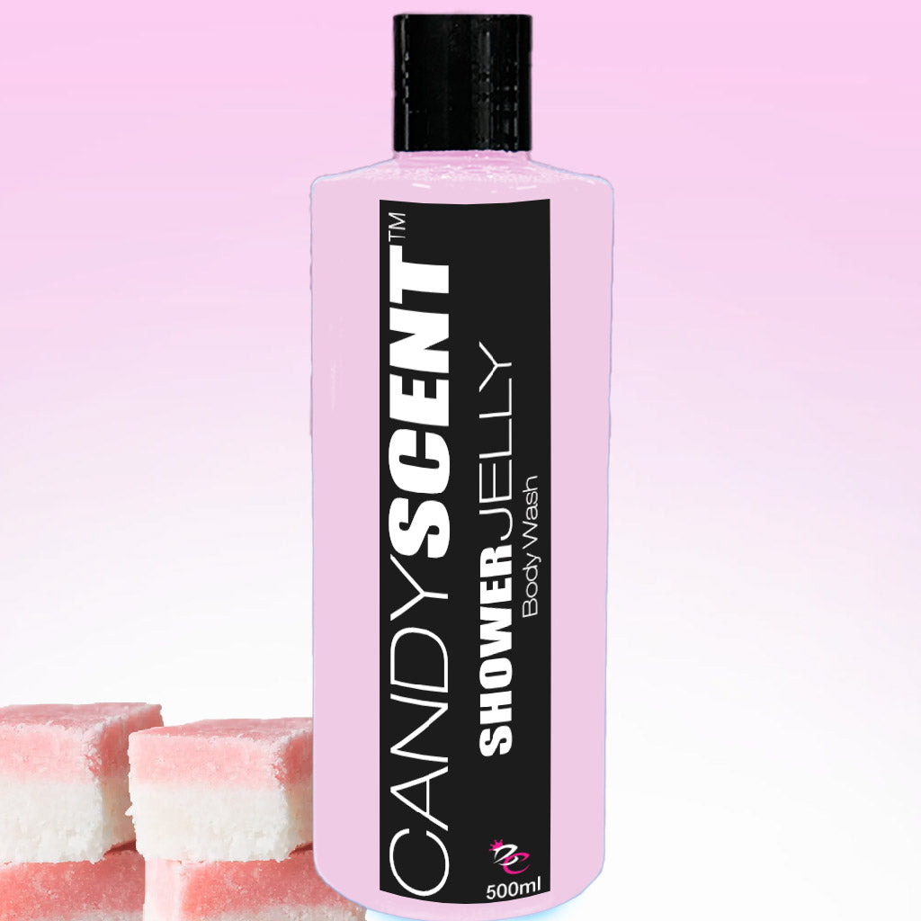 A 500ml bottle of CANDYSCENT™ Shower Jelly Body Wash, adorned with a pink and white label, sits against a gradient pink background. In the foreground, three pieces of pink and white layered, jelly-like candy enhance the scene, highlighting the moisturizing experience ahead.