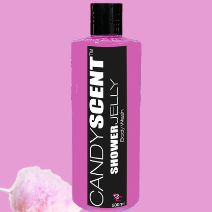 Image of a pink bottle of CANDYSCENT™ Shower Jelly Body Wash. The bottle features a black cap and a black label with white text. Beside it, there is a piece of pink cotton candy on a stick. The background is also pink, enhancing the sweet, playful ambiance.