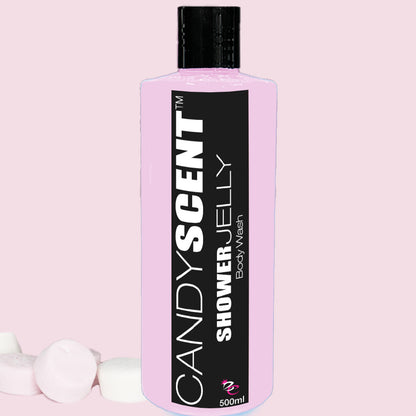 A pink bottle of Shower Jelly Body Wash by CANDYSCENT™ is displayed against a light pink background. The bottle has a black label with white text and contains 500ml of moisturizing product. Marshmallows are scattered near the base of the bottle.