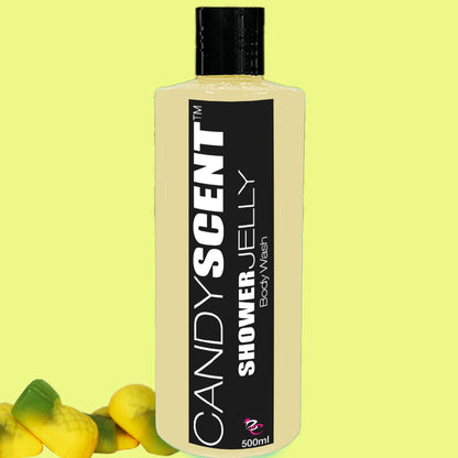 A 500ml bottle of CANDYSCENT™ Shower Jelly Body Wash with a black and white label stands upright against a light green background. Small yellow and green jelly candies are scattered at the base, highlighting its moisturising properties.