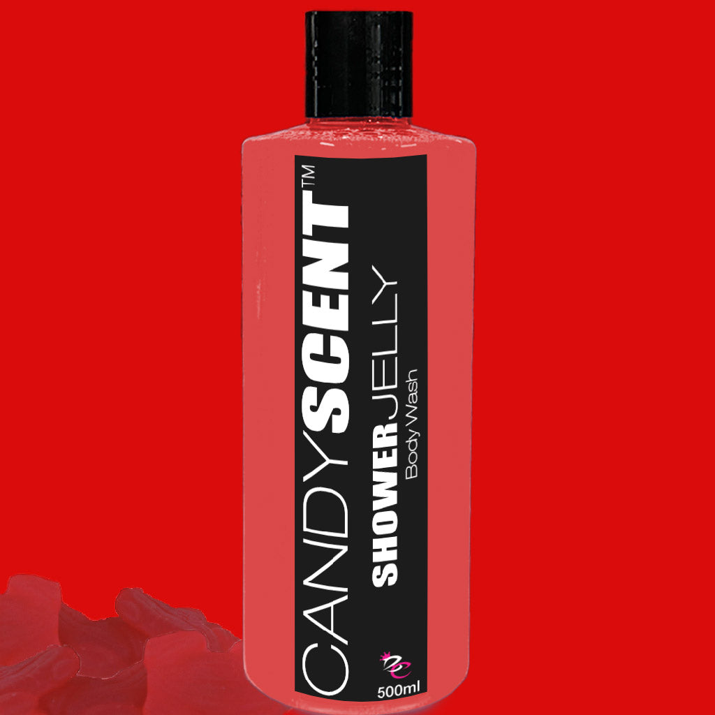 A red bottle of *CANDYSCENT™ Shower Jelly Body Wash* stands against a matching red backdrop. This 500ml bottle features a sleek black cap and a label with white text, promising a luxurious shower experience. The volume is clearly noted at the bottom of the label.