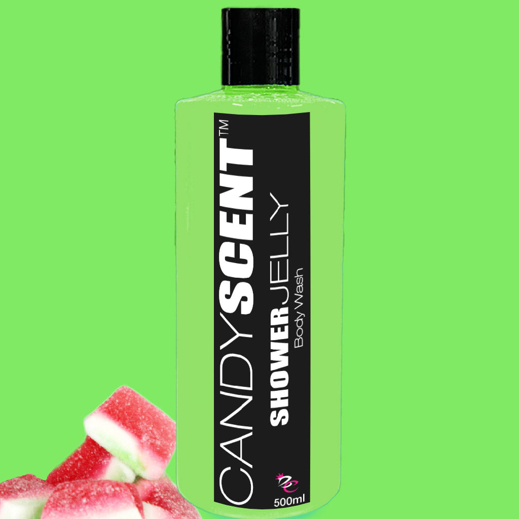 Image of a transparent green 500ml bottle of CANDYSCENT™ Shower Jelly Body Wash against a bright green background. The bottle has a black label with white text. In the bottom left corner, there are a few strawberry and cream candies.