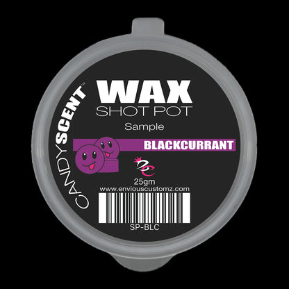 Circular black container lid labeled "(DISCONTINUED CANDYSCENT™'S) Wax Melts Sample" with "BLACKCURRANT" highlighted in pink. It features two smiling purple cartoon faces, a barcode, and offers a delightful home fragrance experience. This 25gm sample of wax melts is perfect for trying before you buy.