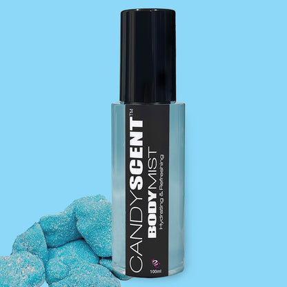 A bottle of CANDYSCENT™ Hydrating Body Mist with a black cap and label on a light blue background. The label reads "CANDYSCENT™ Hydrating Body Mist - Hydrating & Refreshing, 100ml." To the left of the bottle are several blue, sugar-coated candy pieces.