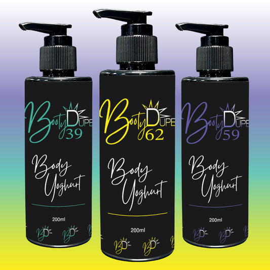 Three black bottles of Body Yoghurt by BOOTY DUPE are displayed against a gradient background. Each hydrating moisturizer is equipped with a pump dispenser and features a distinct number: 39 in teal, 62 in yellow, and 59 in purple, all infused with a refreshing summer fragrance.