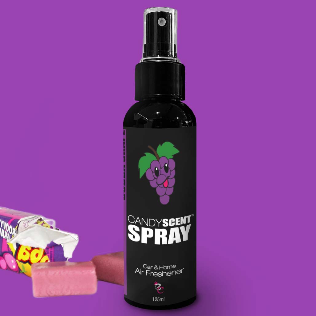 A 125ml bottle of CANDYSCENT™ Car & Home Scent Sprays air freshener, featuring a playful cartoon grape on the label. The sleek black bottle adorned with purple and white accents promises to banish odours with its enduring fragrance. Beside it, an opened candy wrapper spills pink chewy candies onto a solid purple backdrop.