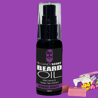 A 50 ml bottle of CANDYSCENT™ Beard Oil with Hemp & Green Tea Extract, labeled "Bubba Grape," is displayed against a purple background. Beside the bottle are two unwrapped pieces of grape-flavored candy and part of the candy's wrapper, showcasing your essential grooming item for optimal beard health.