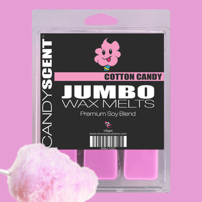 Image of a product package for "Jumbo Wax Melts" from the brand "CANDYSCENT™." The pink packaging features an illustration of pink cotton candy and is labeled "Cotton Candy." The highly scented wax melts inside are also pink. A piece of pink cotton candy is visible in the bottom left corner.