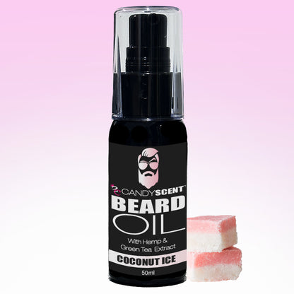 A bottle of Beard Oil from CANDYSCENT™ is showcased against a pink gradient background, featuring hemp and green tea extract for optimal beard health. The label reads "COCONUT ICE" and displays a bearded icon. Two squares of pink and white coconut ice candy are positioned at the bottom right.