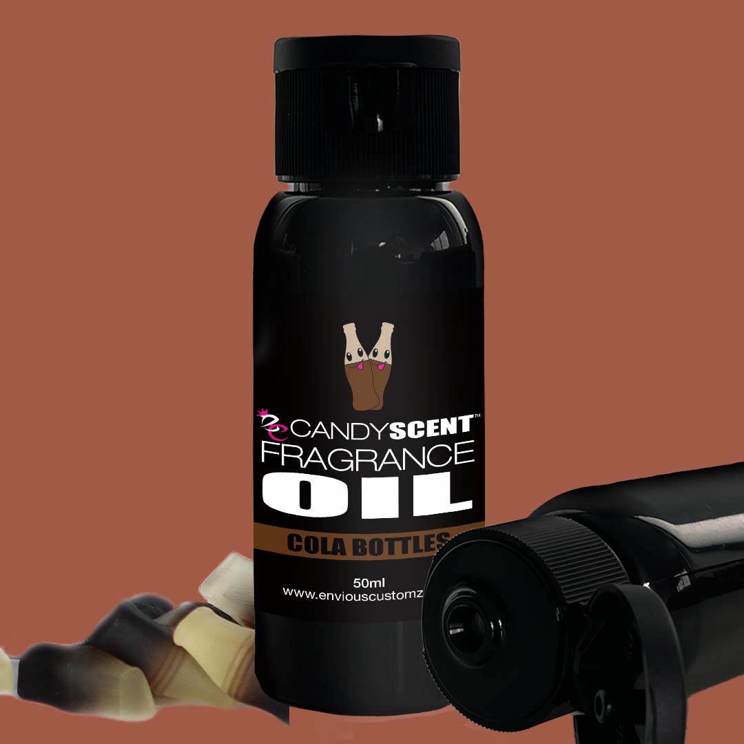 A black bottle labeled "CANDYSCENT™ Fragrance Oil" with a brown background. The 50ml bottle showcases a partially visible image of cola bottle candies on its label, making it perfect for use in an oil burner to create a delightful home scent. Another identical bottle lies horizontally beside it.