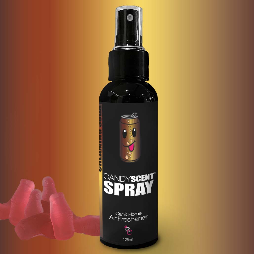 A bottle of CANDYSCENT™ Car & Home Scent Spray stands against a gradient yellow and brown background. The 125 ml black bottle, adorned with a cheerful candy character on the label, is surrounded by pink gummy candies at its base. Designed to eliminate odours with its long-lasting fragrance, this spray is both functional and whimsical.