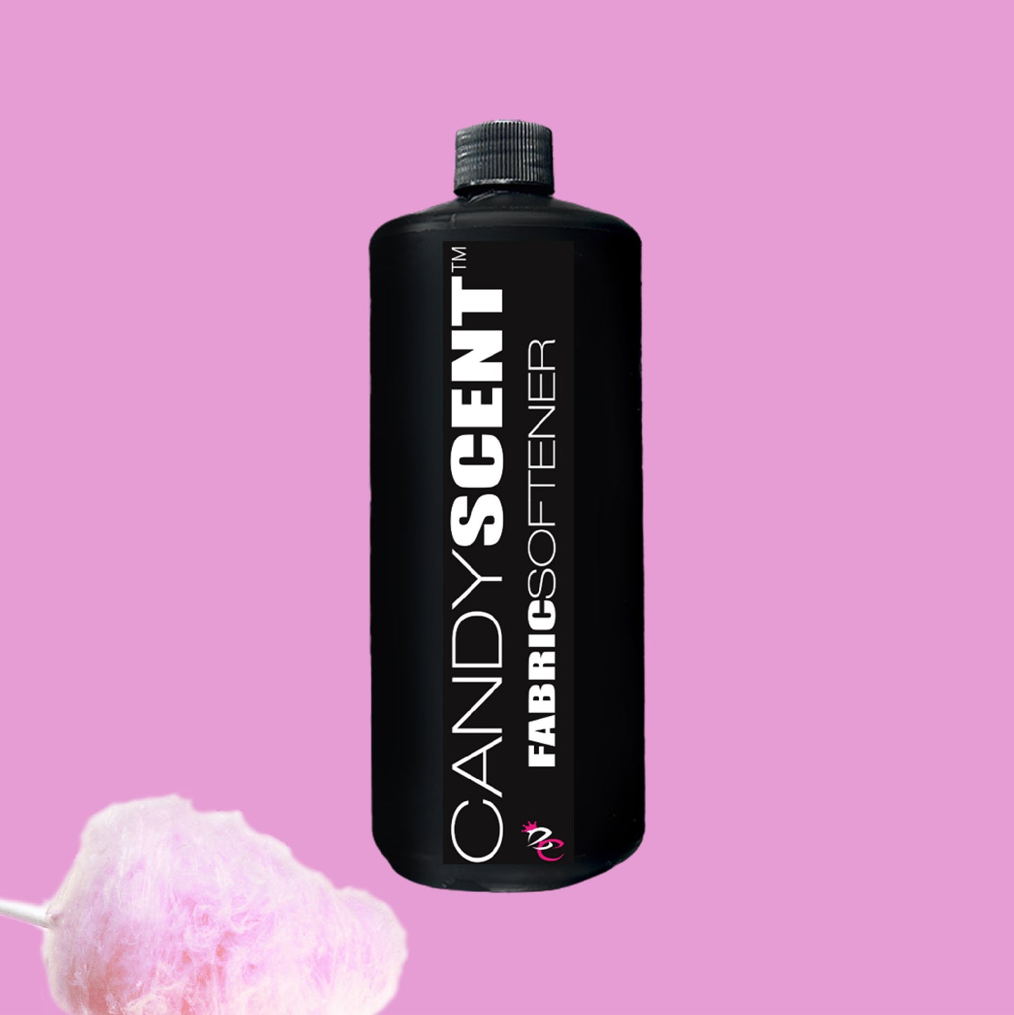 A black bottle labeled "CANDYSCENT™ Fabric Softener" is centered on a pink background. A puff of pink cotton candy at the bottom left corner adds a whimsical touch, promising wrinkle-free clothes with every wash.