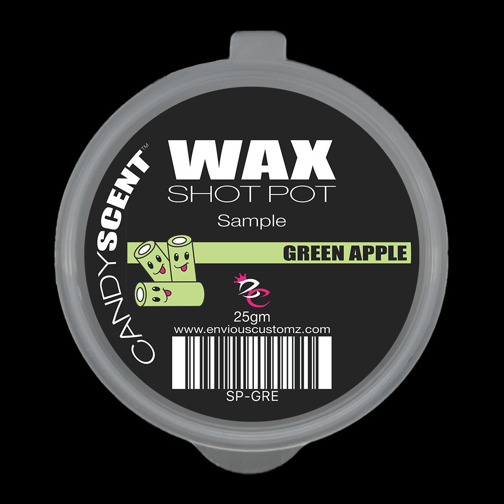 A round container lid labeled "(DISCONTINUED CANDYSCENT™'S) Wax Melts" offers a refreshing "Green Apple" scent. It features a cartoon image of green apples and weighs 25g, making it perfect for home fragrance enthusiasts. Discover more at www.enviouscustomz.com.