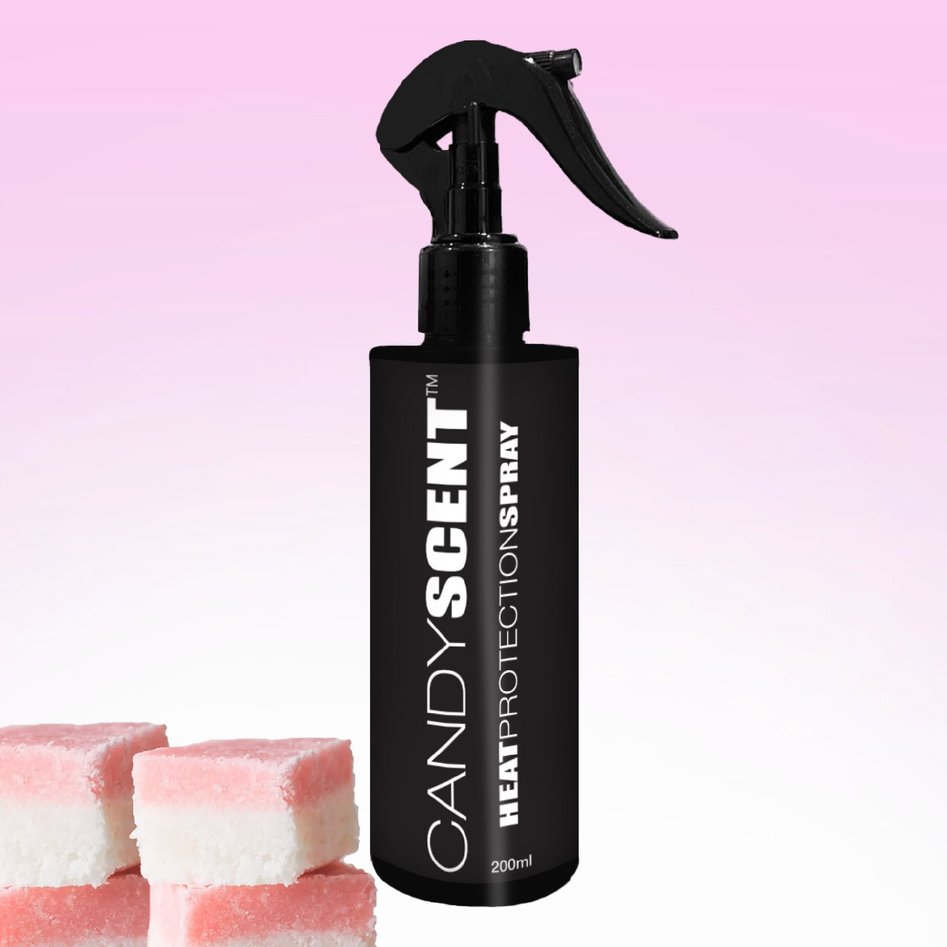 A 200ml black bottle of CANDYSCENT™ Heat Protection Spray, offering salon-quality results, is set against a pink gradient background. It comes with a spray nozzle, and in the bottom left corner are two candy-like squares in pink and white hues, capturing its signature CANDYSCENT™ charm.