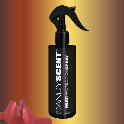 A stylish black spray bottle featuring the "CANDYSCENT™ Heat Protection Spray" label stands against a gradient background of yellow, orange, and brown. Enjoy salon-quality results with a delightful fragrance. Playful red gummy bears are scattered in the bottom left corner.