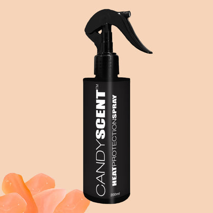 A sleek black spray bottle labeled "Heat Protection Spray" by CANDYSCENT™ promises salon-quality results, set elegantly against a beige background. Orange rock-like elements accentuate the bottom left corner of the image, hinting at its hair-strengthening benefits.