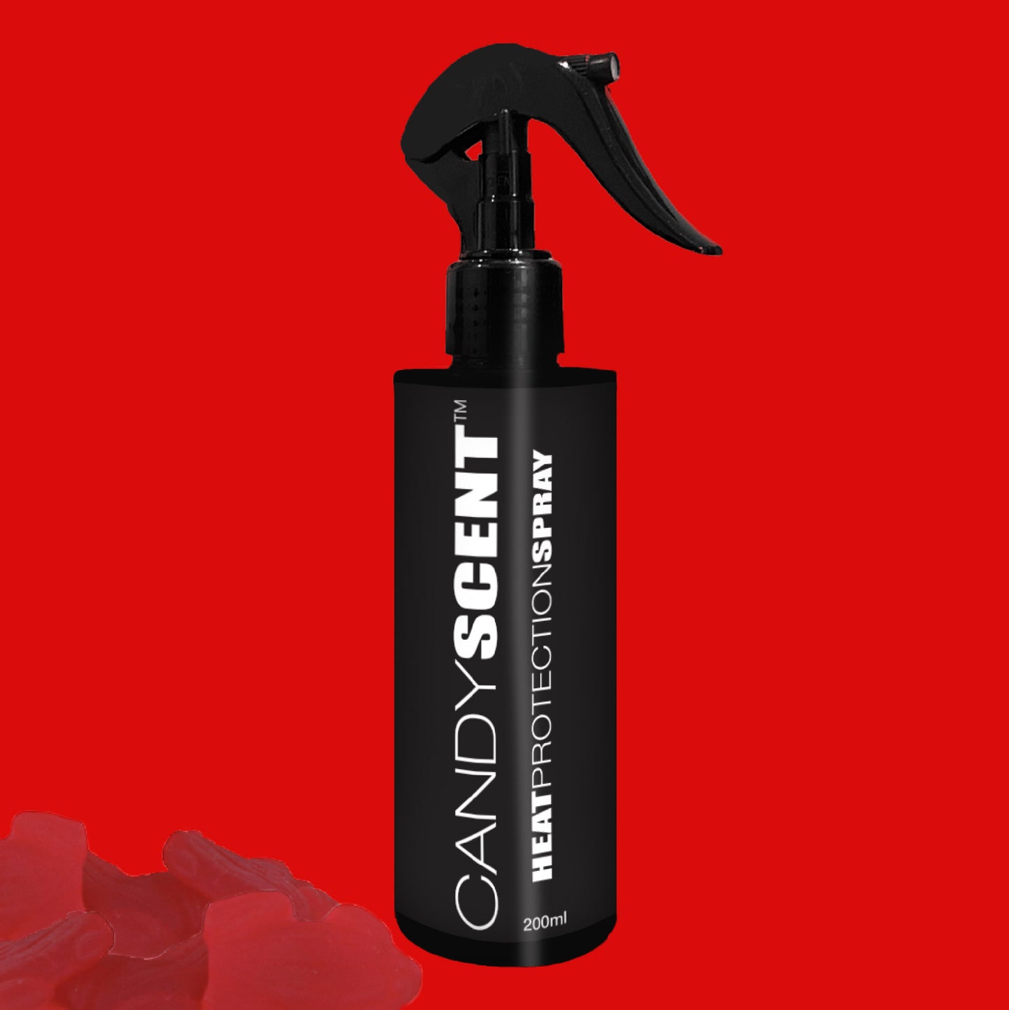 A black bottle of CANDYSCENT™ Heat Protection Spray, promising salon-quality results, is equipped with a spray nozzle and set against a red background. The label prominently displays the product name in bold white text.