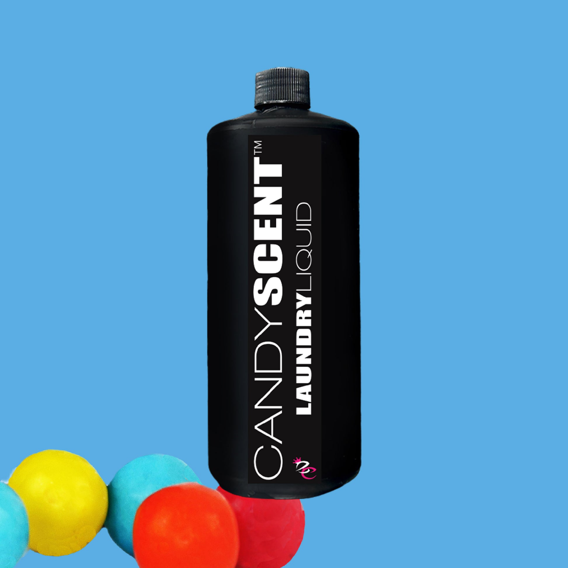 A black bottle labeled "CANDYSCENT™ Laundry Liquid" sits against a blue background, giving off an eco-friendly aura. Biodegradable, colorful round objects embellish the bottom left of the image, enhancing its charm.