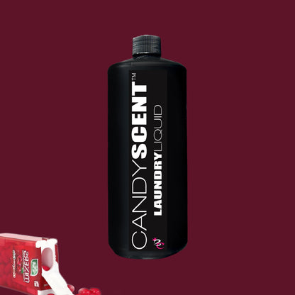 A black bottle adorned with the label "CANDYSCENT™ Laundry Liquid" stands upright against a dark red background, highlighting its eco-friendly charm. In the lower left corner, red candies spill out of an open package, suggesting the biodegradable magic within.