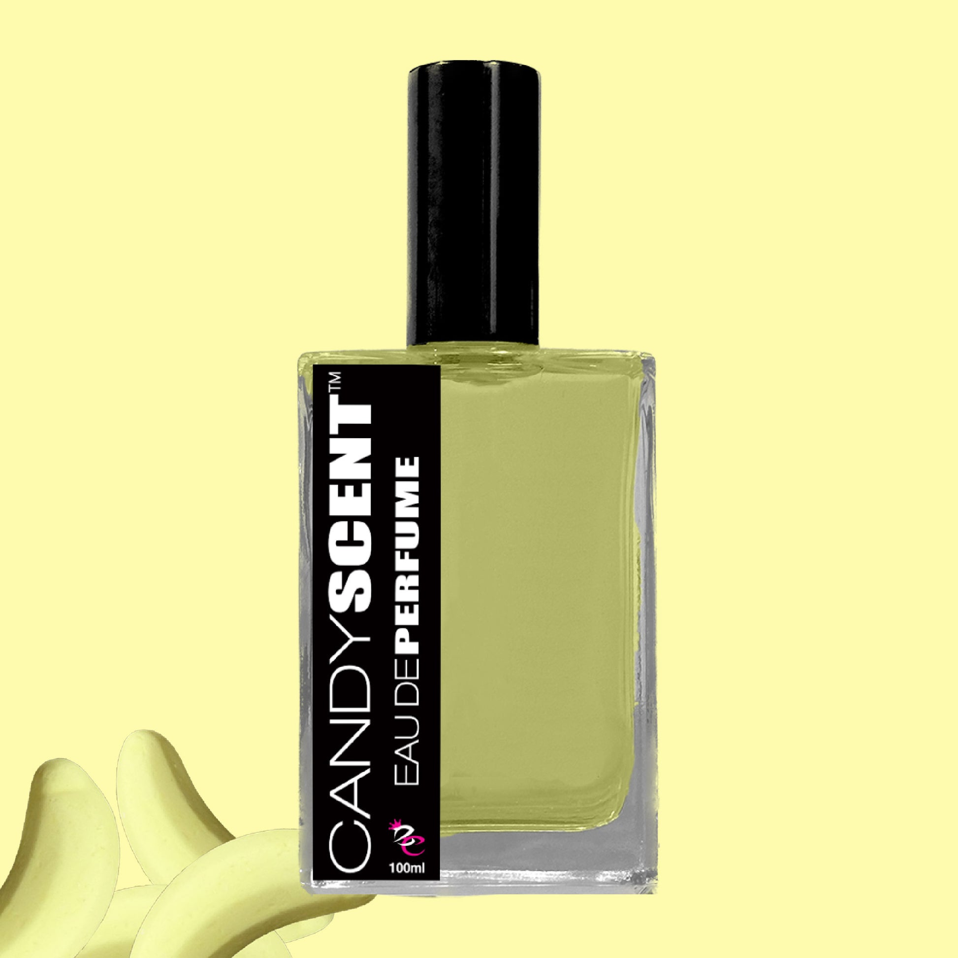 A bottle of Eau De Perfume / Cologne by CANDYSCENT™ is displayed against a yellow background. The perfume bottle features a black cap and a black label with white text. Two peeled bananas are partially visible at the bottom left of the image, evoking sweet, playful fragrances reminiscent of sugary treats.