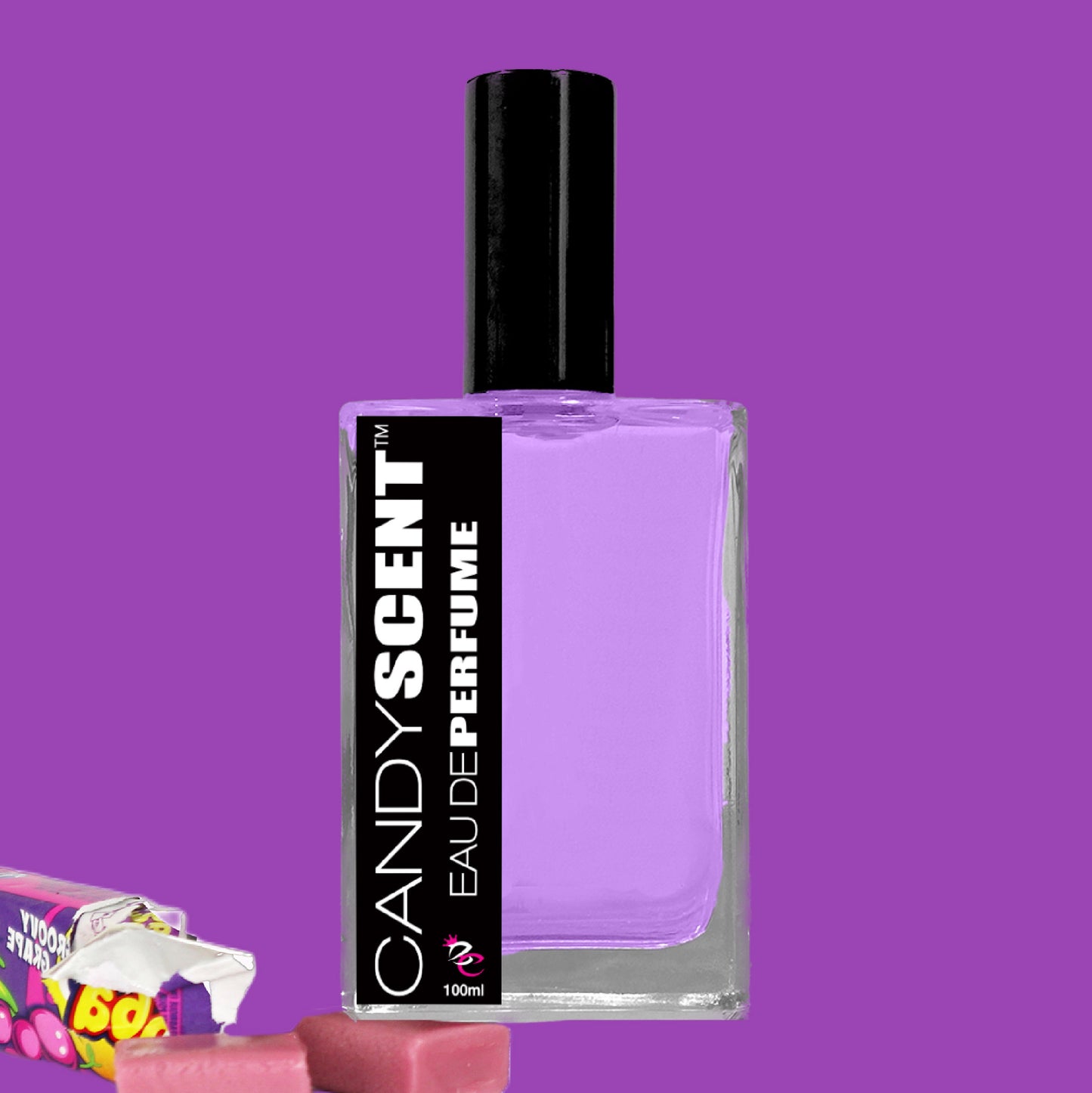 A bottle of "Eau De Perfume / Cologne" by CANDYSCENT™ featuring a purple liquid, a black cap, and a black label with white text. The background is purple, and in the bottom left corner, pieces of pink candy are placed near a partially opened candy wrapper. This playful fragrance encapsulates the essence of sugary treats.