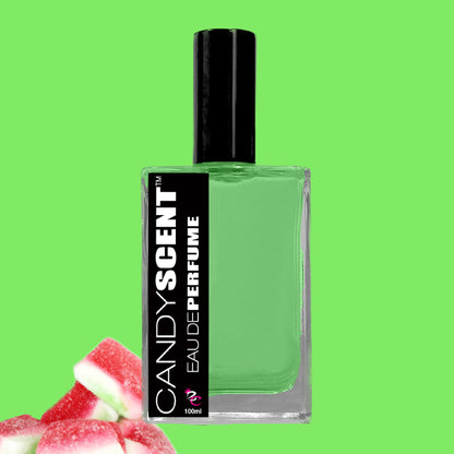 A clear rectangular perfume bottle with a black cap is labeled "CANDYSCENT™ EAU DE PARFUM 100ml." The bottle contains green liquid. In the bottom left corner, there are pink and white soft candies against a bright green background, ideal for those who love sweet fragrances for everyday wear.