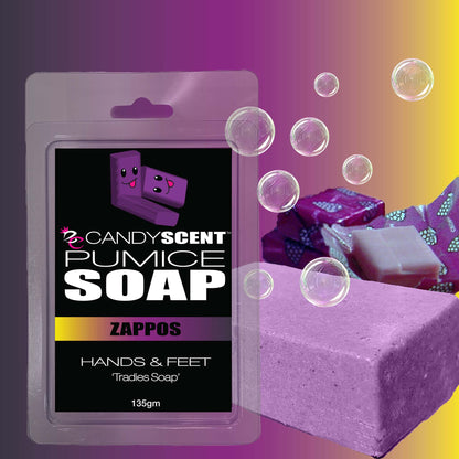 A product image of CANDYSCENT™ Pumice Soap for hands and feet, featuring packaging with two cartoon characters with smiling faces. The image also showcases soap bubbles and a purple bar of exfoliating soap against a gradient background of yellow, pink, and purple.