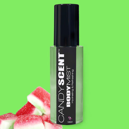 A clear bottle of CANDYSCENT™ Hydrating Body Mist with a black label and cap is centered in the image. The label reads "Hydrating & Refreshing, 100ml" in white text. Bringing soothing benefits of witch hazel, a pile of pink, green, and white gummy candies sits in the lower left corner. The background is green.